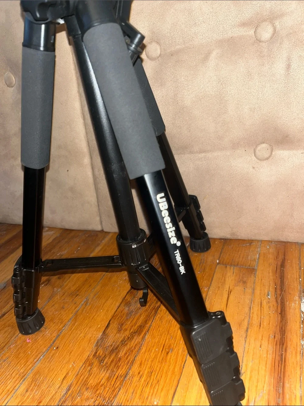 Black Camera Tripod with Foam Grip and Adjustable Head